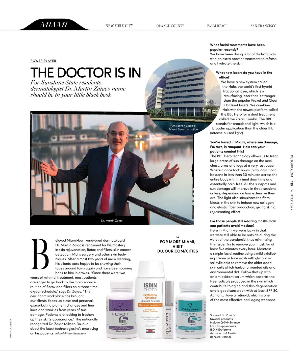 Magazine page from DuJour titled The Doctor Is In, featuring Dr. Martin Zaiac standing by a waterfront with skincare products shown below