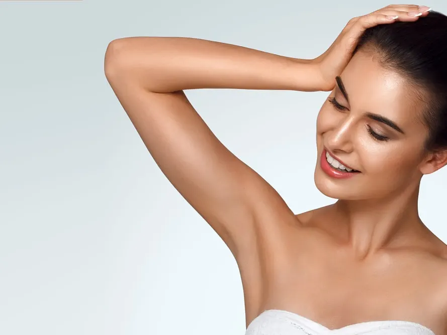 Woman after Botox treatment for excessive underarm sweating in Miami Beach, FL