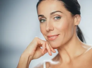 Woman with refreshed appearance after dermal fillers in Miami, FL