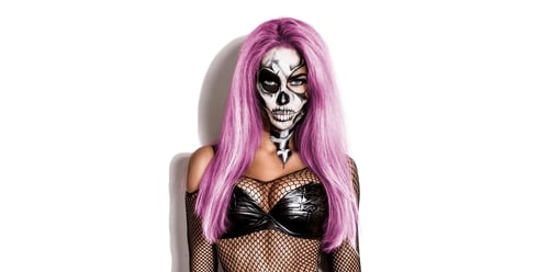 Sexy woman in top hat and skull make up