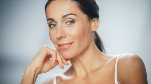 Woman with refreshed appearance after dermal fillers in Miami, FL